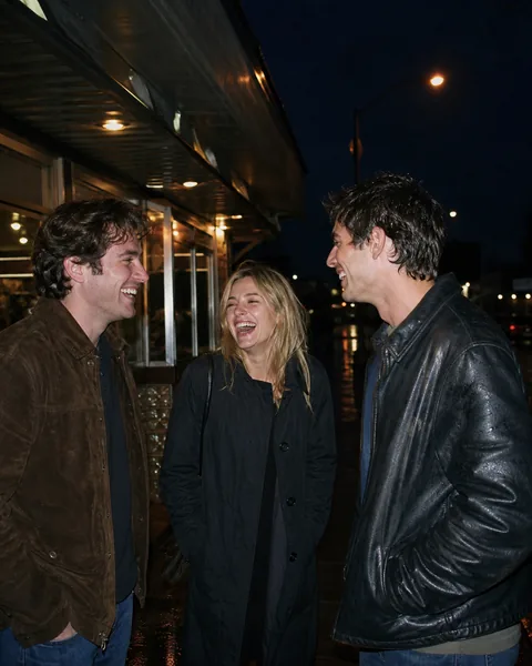Original rainy night photograph before a direct-flash film look