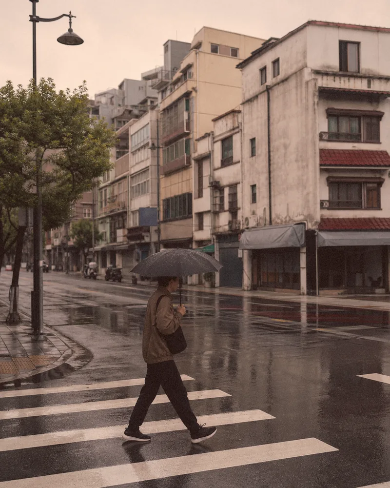 The same rainy street after a warm, faded retro snapshot treatment with nostalgic color.